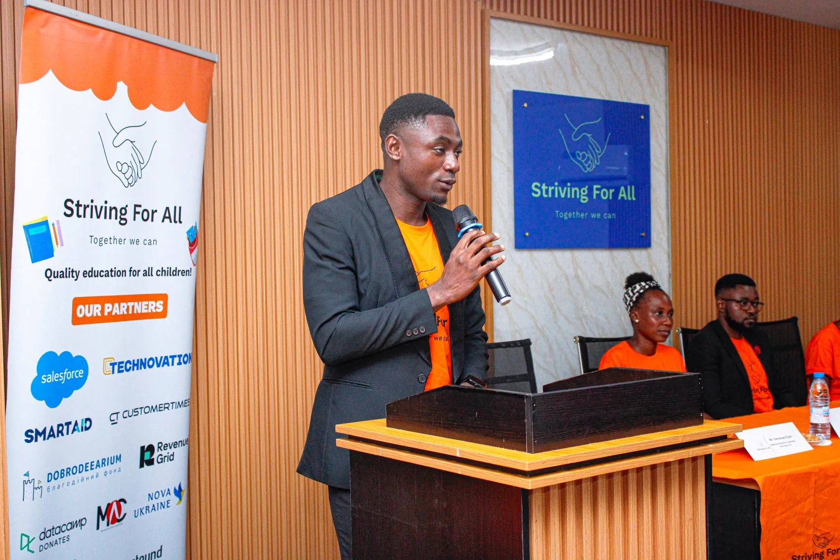 M_Elouti_Having_a_speech_infront_of_students_parents_and_community