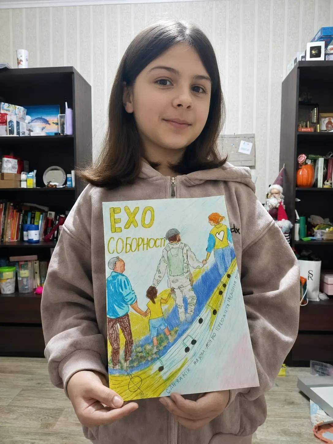 Ukrainian girl holding her artwork
