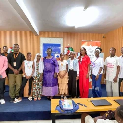 Diverse group of young people and adults assembled at a community outreach program.