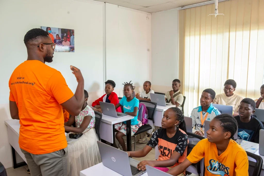 instructor speaking to students in classroom